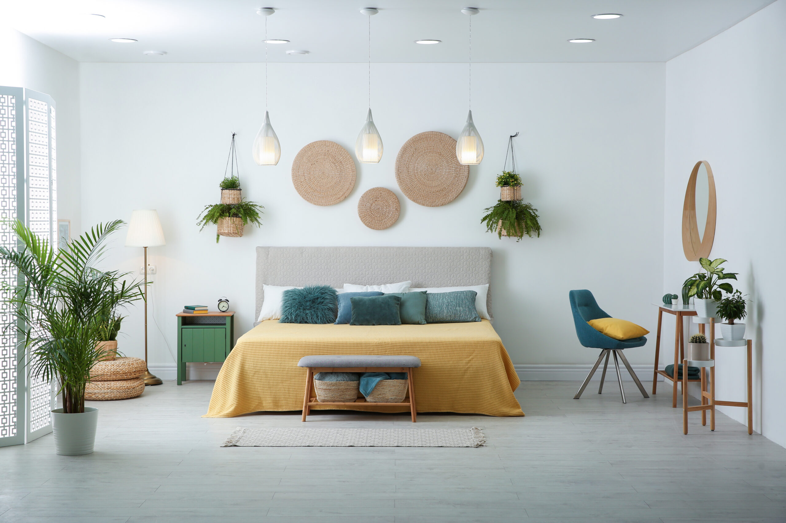 Stylish room interior with large comfortable bed